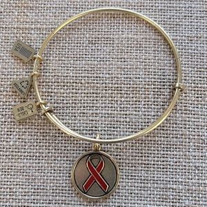 Wind and Fire Red Ribbon Gold Tone Bracelet